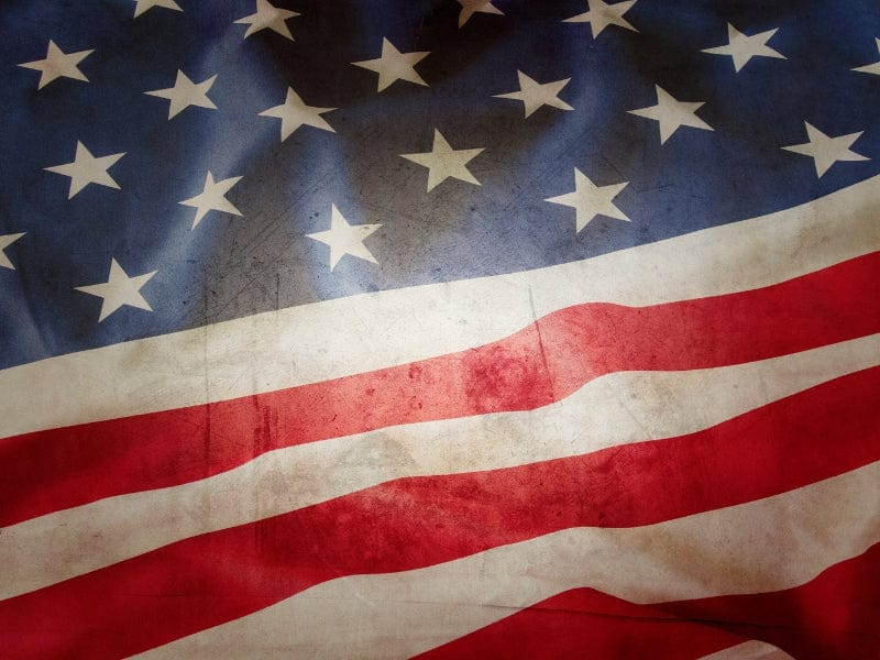 Waving American flag with stars and stripes, symbolizing patriotism and national pride