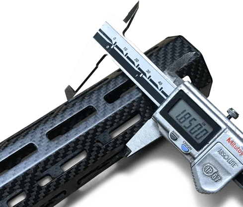 Digital caliper measuring a carbon fiber tube showcasing precision engineering in codaevolution